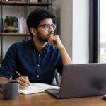 Young Indian professional planning his career and learning new skills